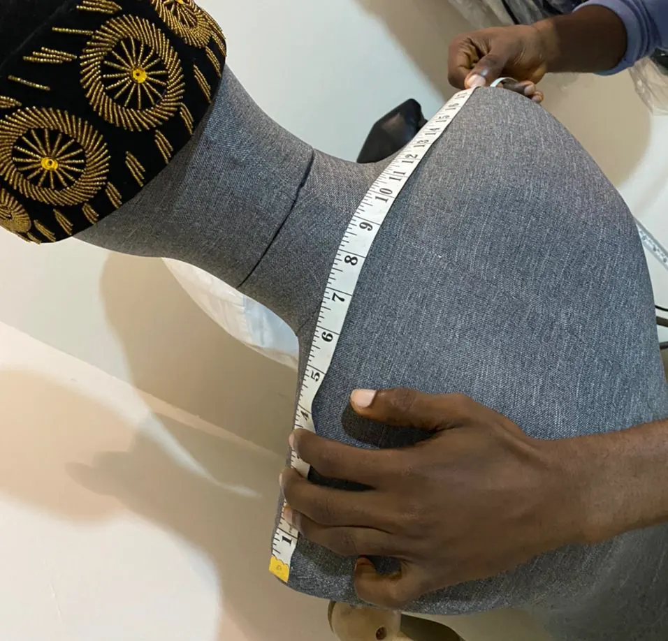 Tape measure placed across the back of a tailoring mannequin